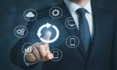 Businessman interacting with futuristic holographic interface displaying digital icons and data