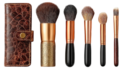 A set of five makeup brushes, housed within a brown leather case.  The brushes have copper-colored handles and varying sizes.  The case is textured leather, reminiscent of crocodile skin