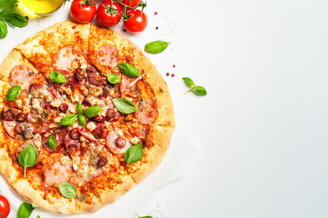 Delicious meat pizza with ham, salami and sausages.