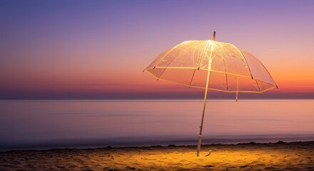Luminous clear umbrella glows on beach at dusk, sky ablaze with hues of orange, purple, and pink