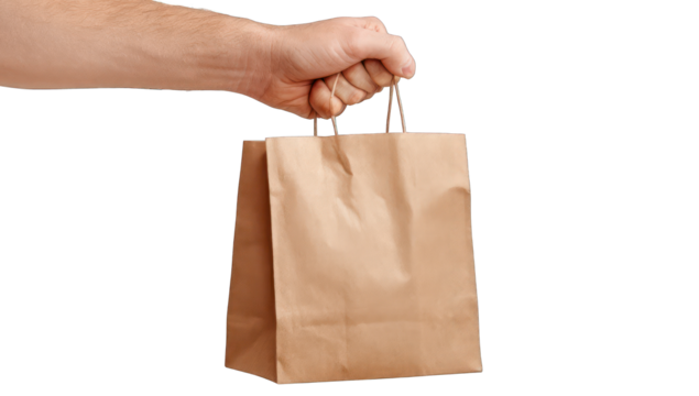 A person's hand holds a brown paper bag