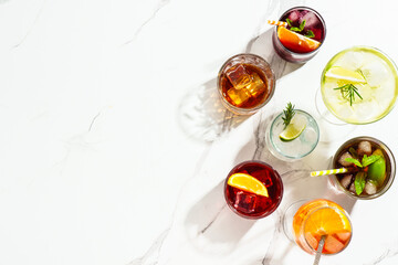 Alcohol cocktail drinks at white background.