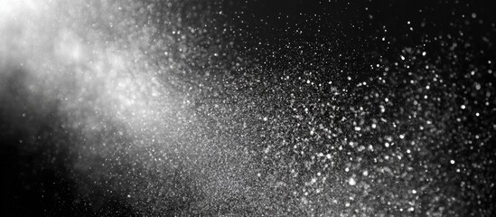 Obraz premium Abstract grayscale image of dispersed light particles
