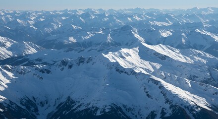 A snow-covered mountain range breathes like a sleeping lung, a powerful metaphor for a living planet, deep time, and the slow, majestic pulse of nature