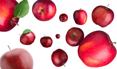 Fresh red apples swirling in air against white background