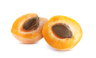 Fresh apricot halves with kernels isolated on white