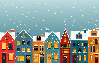 A charming winter scene with colorful houses covered in snow, creating a cozy and festive atmosphere.