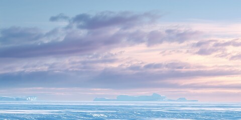 Obraz premium Arctic winter sky over Greenland, pale blue and white tones, soft pastel horizon glow, thin silhouettes of icebergs at the bottom
