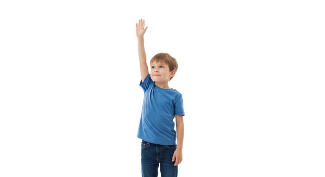 A young boy with brown hair wearing a blue shirt and jeans raising his right hand in the air smiling