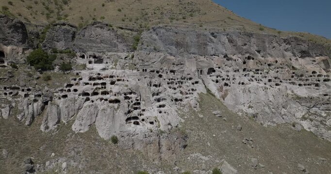 Aerial view of the ancient cave monastery complex, carved into the Erusheti Mountain, creating a mesmerizing landscape, Gogasheni, Samtskhe-Javakheti, Georgia.
