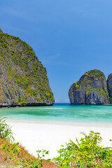 THAILAND, PHI PHI ISLAND, 30 March 2023.Tourists enjoying on the white sand Maya Bay beach and turquoise water of lagoon, popular destination for tourist in Shang-nga province, Southern of Thailand