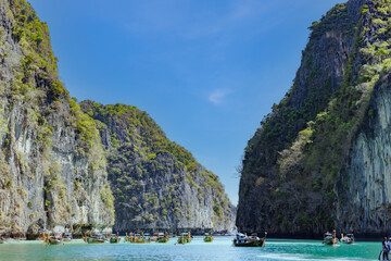 Many fishing boat with tourists in the beautiful crystal clear water at Pileh Lagoon, Krabi, Southern of Thailand, on May 30,2023 in Phi Phi National Park, Krabi Province Thailand