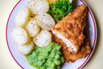  Breaded Cod Fillet With Sliced New Potatoes And Mushy Peas