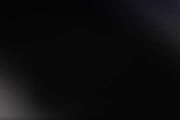 Minimalist dark abstract image with deep black tones and subtle gray gradients, evoking mystery and...