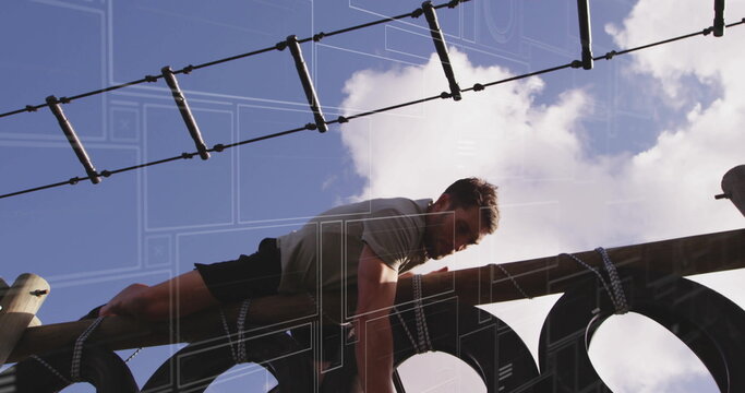 Climbing man in athletic shirt and shorts crossing obstacle course wooden beam and rope ladder