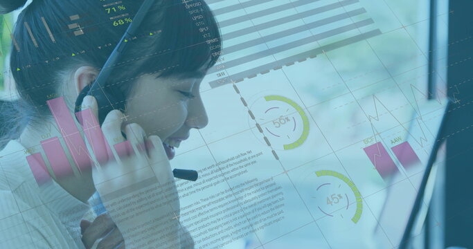 Speaking Asian agent wearing white collared top at office desk, with headset and data overlays