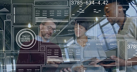 Collaborating professionals reviewing data on laptops in office, with augmented reality overlays