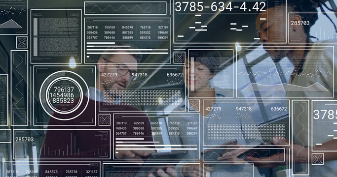 Collaborating professionals reviewing data on laptops in office, with augmented reality overlays