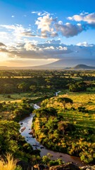 Obraz premium A serene vista of a winding river flowing through a lush, verdant valley, bathed in the golden hues of a tranquil sunrise.