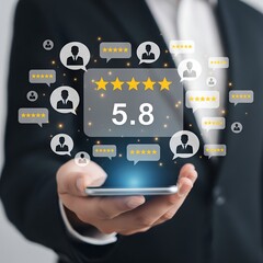 Fototapeta premium Businessperson holding smartphone displaying customer feedback and star rating with digital icons