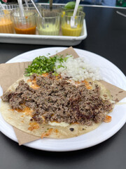 Lamb taco with flour tortilla and fresh toppings