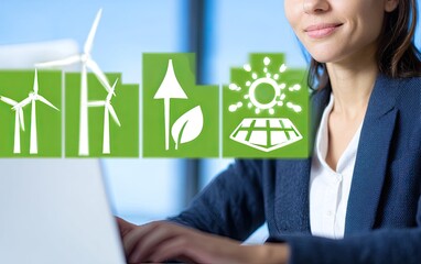 Businesswoman working on laptop with green icons of renewable energy