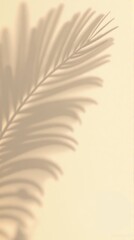 Fototapeta premium Palm Leaf Shadow on Beige Background: Minimalist, Natural, and Aesthetic Design.