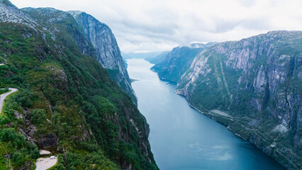 Discover the breathtaking beauty of Lysefjord in Norway surrounded by majestic cliffs
