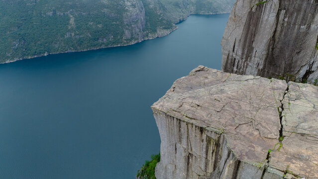Breathtaking view from Preikestolen cliff overlooking Lysefjord at sunrise in Norway