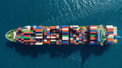 Aerial Top View of Cargo Container Ship with Colorful Containers Traveling in Blue Ocean under Bright Sunlight - Powered by Adobe