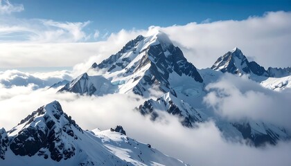 Majestic snow-capped mountain peaks rise above a sea of clouds, showcasing a breathtaking winter landscape.