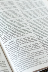 Obraz premium The LORD's call to repentance text in open holy bible book. Christian biblical concept of god's mercy and grace.