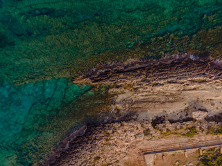 Aerial View of Cyprus Coastline with Turquoise Waters and Rocky Cliffs