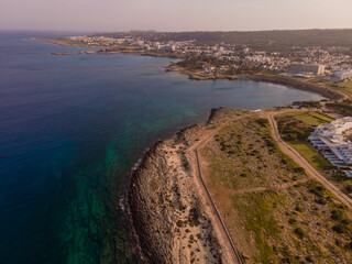 Aerial View of Cyprus Coastline with Cliffs, Beach, and Turquoise Sea
