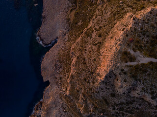Aerial View of Rocky Cyprus Coastline with Cliffs and Turquoise Sea