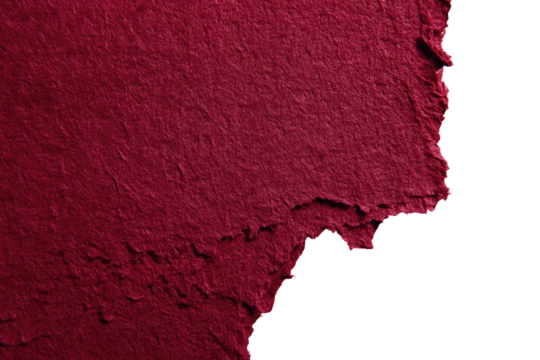 Textured crimson paper fragment against black