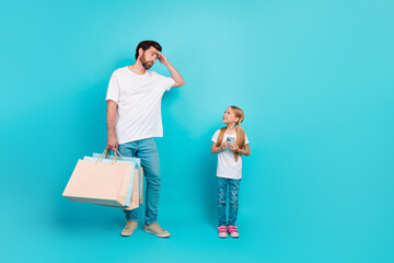 Father and daughter on turquoise background with shopping bags and phone, expressing family bonding and lifestyle