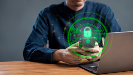 Man using smartphone with digital security lock screen symbol showing cybersecurity, data...