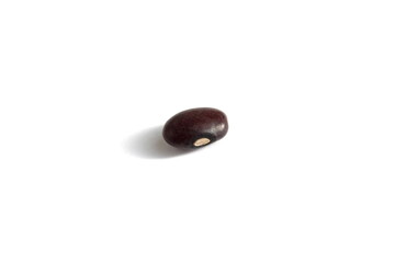 There is one bean grain lying on a white background.