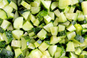 Texture of diced lots of fresh cucumbers.