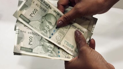 Money counting by hands Indian currency 500 rupee notes, symbolizing wealth and financial success
