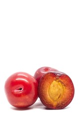 Closeup of Plum Fruit Isolated on White Background with Copy Space