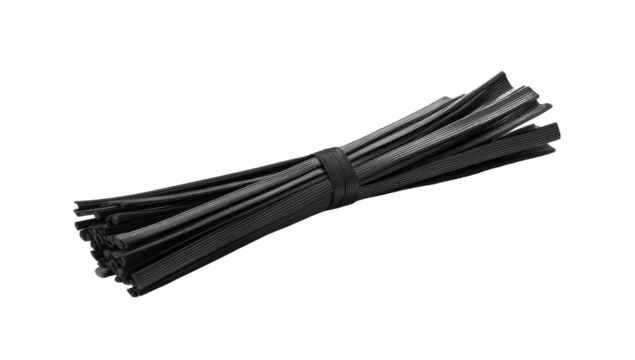 A bundle of numerous thin, black plastic strips, tightly bundled together and tied with a black elastic band