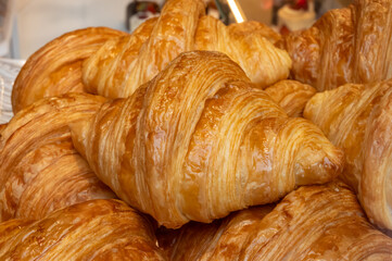 Butter puff croissants and chocolatine on display in artisanal bakery in Tpulouse, France