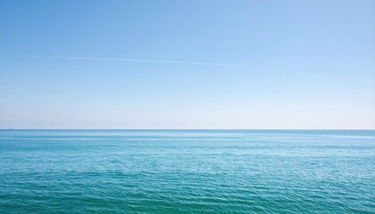 Fototapeta premium Azure expanse of ocean meeting a serene sky