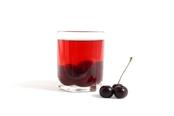 There is a transparent glass with cherry compote on a white background.