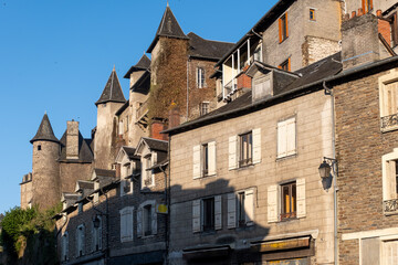 Obraz premium Walking in Uzerche, historical fortified royal patronage medieval town in Correse department, Nouvelle-Aquitaine, France, old houses and narrow streets