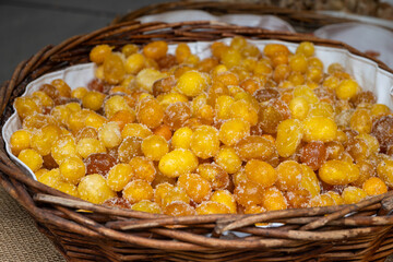 Dehydrated dried tropical fruits in pieces, mango, berries, citrus on weekly food market in Toulouse, France