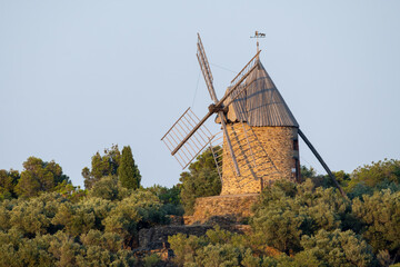 Old wind mill in Collioure, narrow streets and yellow, pink, orange houses, summer vacation...