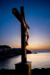 Chapel cross of colourful Collioure, summer vacation destination town with historical buidings and...
